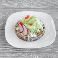 10. Sopes · Homemade tortilla with choice of protein, refried beans, lettuce, tomato, cheese, sour cream...