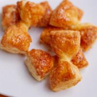Zu Zus  · A dozen bowties of Puff Pastry glazed in honey and cinnamon
