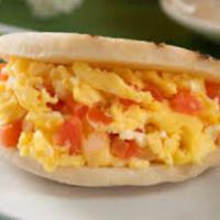 Perico Arepa · Corn flour arepa with scramble eggs with tomatoes, onions and peppers.