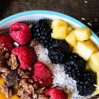 Coconut Chia Bowl · Mango compote, granola, shredded coconut, pineapple, berries