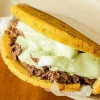 Downtown Arepa · Sol arepa (with yellow cornflour and lentils) with Short Ribs and Venezuelan Mano Cheese