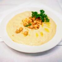 Hummus · Crushed garbanzo beans mixed with fresh lemon juice, extra virgin olive oil and  tahini sesa...