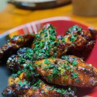 Wings · Cooked wings of a chicken coated in sauce or seasoning. Add fries for an extra charge.