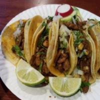 1. Tacos · Topped with onion, cilantro and your choice of beef, chicken, carnitas or longaniza.