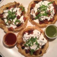7. Sopes for 3 · Handmade corn tortilla topped with beans, lettuce, onions, tomato, cream cheese and choice o...