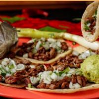 Soft Asada Tacos · Served with baked potato, guacamole, grilled and fresh onion, cilantro and salsa.