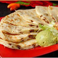 Cheese Quesadilla · Served with sour cream and guacamole. Add meat for an additional charge.