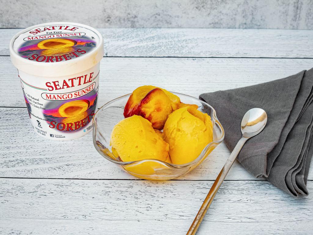 Mango Sunset Sorbet · Pint. The tropical flavor of ripe mangoes with the compliment of tart raspberries. This sorbet has a beautiful yellowish-red coloring that inspires memories of an evening with this light tasty dessert and the romantic sunset over and over.
