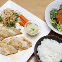 Flounder · Grilled flounder with ginger sauce. Served with rice and soup or salad.