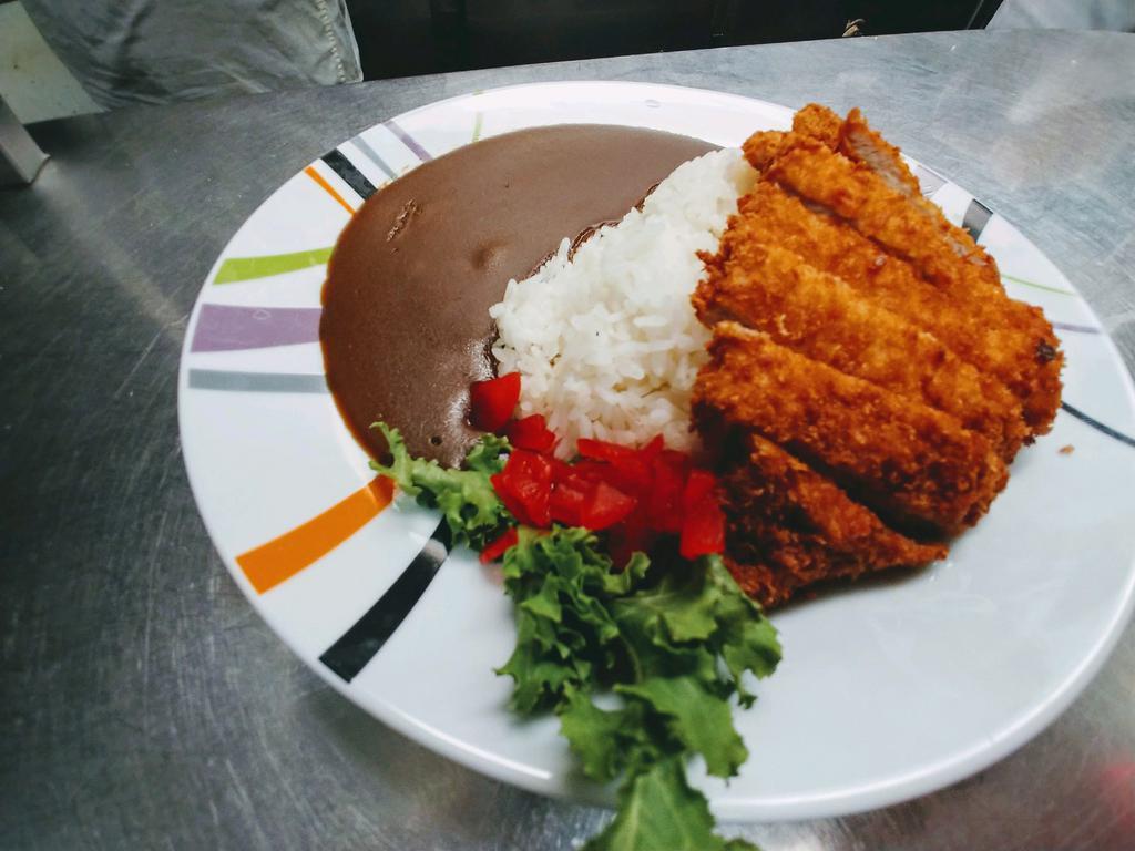 Pork Katsu Curry · This is a rich and flavorful Japanese katsu curry served with chicken katsu or tonkatsu over rice.  Medium Hot