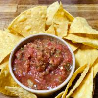 Salsa & Chips · Vibrant and delicious salsa... perfect for dipping!