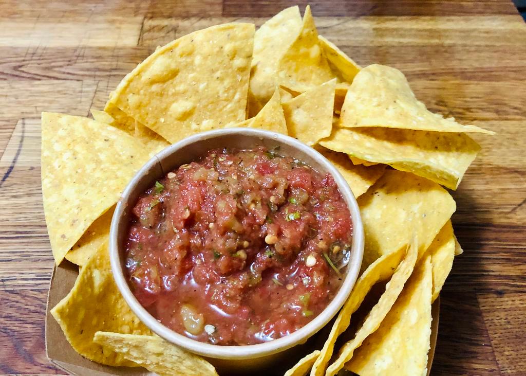 Salsa & Chips · Vibrant and delicious salsa... perfect for dipping!