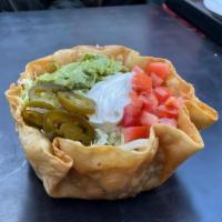 Taco Salad -ground beef · A crispy flour tortilla bowl layered with shredded lettuce, ground beef and monterey jack ch...