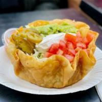 Taco Salad -black bean · A crispy flour tortilla bowl layered with shredded lettuce, black beans and monterey jack ch...