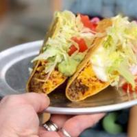 Crunchy Taco -ground beef · Crispy corn taco shell with ground beef, cheddar cheese, mild sauce, lettuce and tomato.