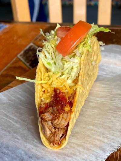 Crunchy Taco -chipotle chicken · Crispy corn taco shell with shredded chicken (simmered in chipotle sauce), cheddar cheese, mild sauce, lettuce and tomato.