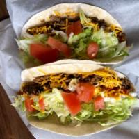 Soft Taco -ground beef · Soft flour tortilla with ground beef, cheddar cheese, mild sauce, lettuce and tomato.