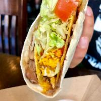Taco Loco -traditional chicken · Soft flour tortilla spread with pinto beans and wrapped around a crunchy chicken taco.
