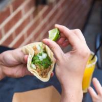 Street Taco -pork carnitas · Traditional Mexican taco. Two corn tortillas filled with pork carnitas, diced onions and cil...
