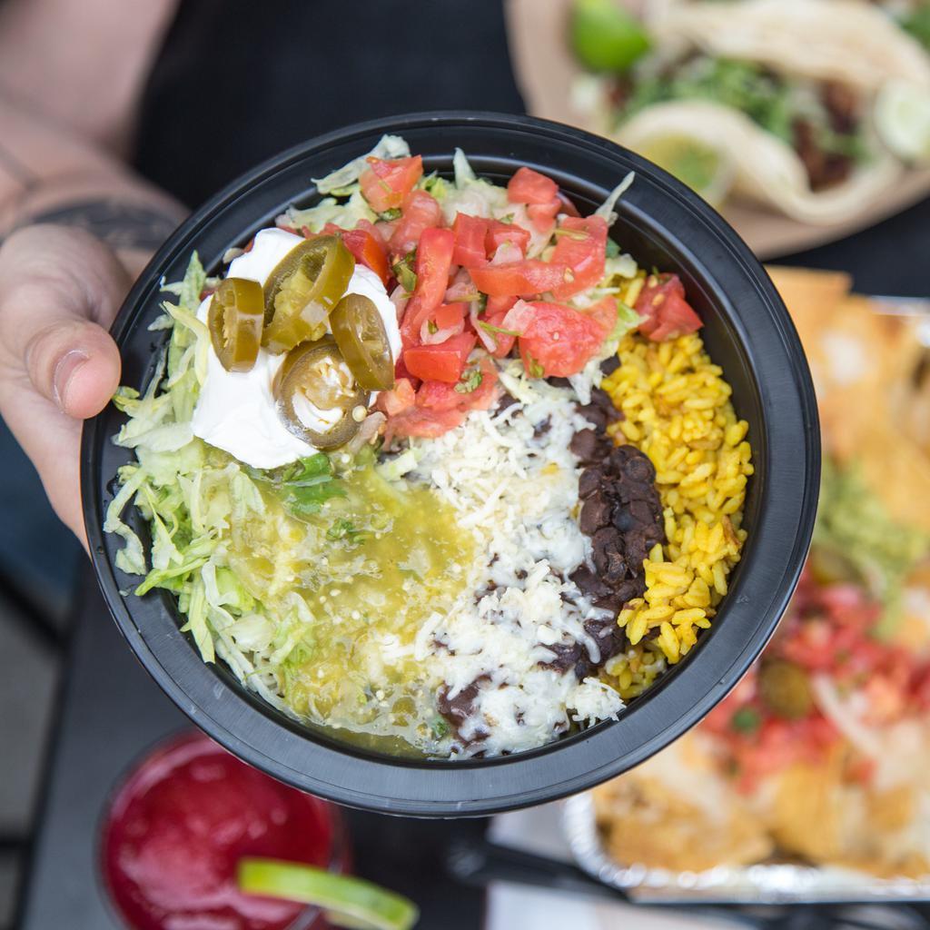 Burrito Bowl -ground beef · No tortilla. Bowl layered with rice, black beans ground beef, jack cheese, tomatillo, pico de gallo, lettuce and sour cream.