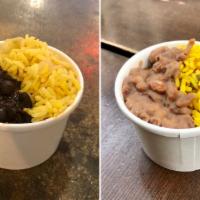 Rice & Beans · Yellow rice and your choice of black or pinto beans.