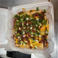 Loaded Fries · French fries, cheese, bacon bits, green onions, sour cream parsley.