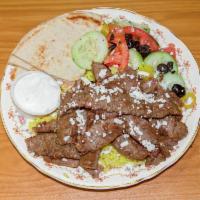 Gyro Plate · Sliced thin seasoned beef and lamb mix over top rice and salad with pita bread and homemade ...
