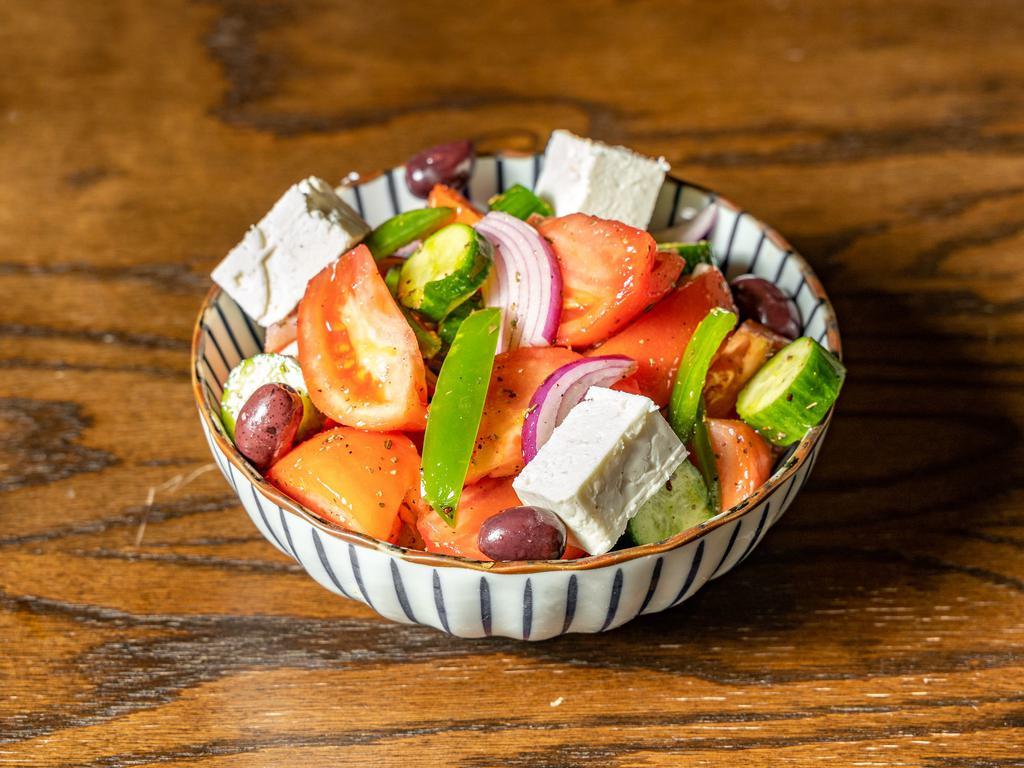 Greek Salad · Lettuce, tomatoes, cucumbers, green peppers, red onions, feta cheese, olives, stuffed grape leaves.