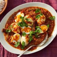 Anda Curry · Boiled eggs simmered in spicy masala gravy giving a nice tangy taste of tomatoes coupled wit...
