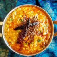 Yellow Dal Tadka · Yellow lentils slow-cooked, and sauteed with fresh garlic and ginger.