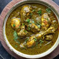 Saag Chicken · Tender chicken cooked in spinach pure and herbs gravy.