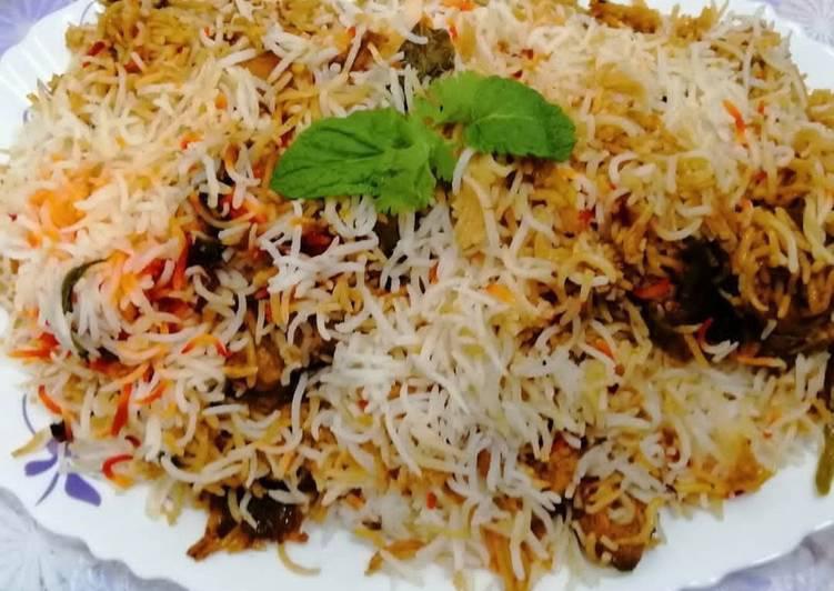 Chicken Dum Biryani · Long grain basmati rice cooked with chicken, tossed herbs, and exotic spices and garnished with saffron threads.