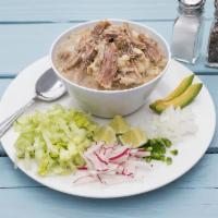 Pozole White Guerrero Style · Stew with its traditional snack, chiles, onion, avocado and toasted radishes.