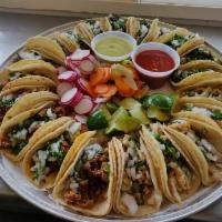 Familiar taco plate · 20 tacos 4 different meats 5 chicken 5  asada (steak) 5 pastor (marinated pork) 5 carnitas (...