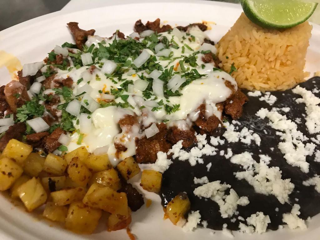 Pastor Platillo · Marinated pork. Variety of authentic Mexican dishes with beans, rice and fresh home-made, gluten free corn tortillas.