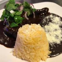 Chicken in Mole Platillo · Variety of authentic Mexican dishes with beans, rice and fresh home-made, gluten free corn t...