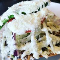 Steak Tostada · Fried corn tortilla with steak. Served with a mixture of cabbage, onion, tomato, radishes, a...