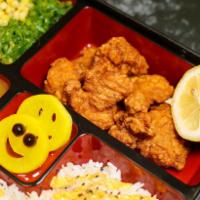 Fried Chicken Bento Box  · Served with Curry (Mild), Seaweed Salad, Rice, Corn, Radish, Fried Chicken . Contains Sesame...