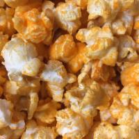 Cheddar Cheese Popcorn · A Little Sweet and Savory Golden Blanket of Deliciousness.
(contains milk,whey and soy)