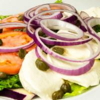 Caprese Salad · Fresh mozzarella, tomatoes, olives and capers.