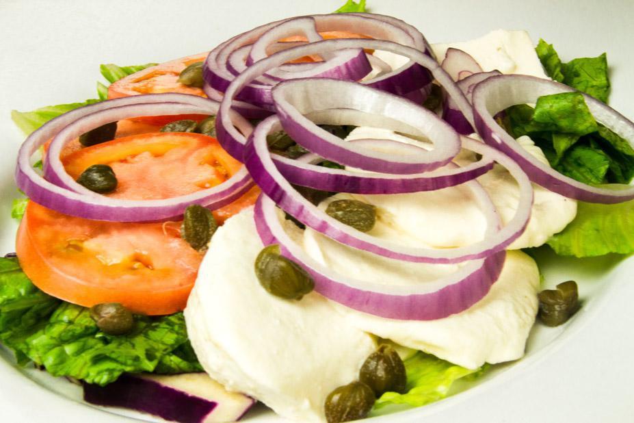 Caprese Salad · Fresh mozzarella, tomatoes, olives and capers.