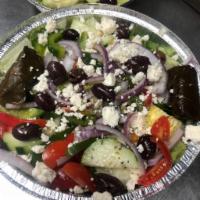 Greek Salad · Romaine, cherry tomatoes, cucumbers, red onions, feta cheese, kalamata olives & grape leaves.