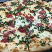 Margherita Pizza · Fresh mozzarella and basil. 