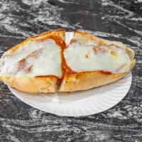 Chicken Parmigiana · Breaded chicken, tomato sauce and cheese. Served with Italian bread. 