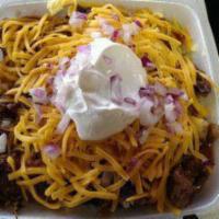 Texas Loaded Baked Potato · Chopped brisket, BBQ Sauce, butter, cheese, sour cream and chopped purple onions.
