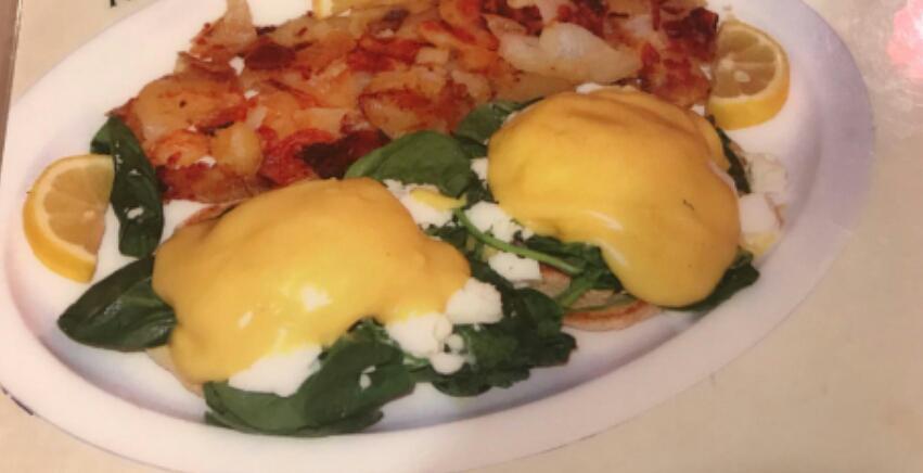 Keystone Florentine Benedict · Poached eggs, feta cheese, and sauteed spinach on an English muffin topped with hollandaise sauce and home fries.