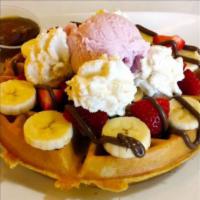 Waffle Sundae · Belgian waffle topped with three (3) scoops of ice cream. Served with syrup and whipped cream.