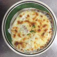 Crock of Homemade French Onion Soup · Choose to top with shredded cheese (optional)