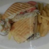 Tom Turkey Panini · Roasted red pepper and Swiss cheese. Served with french fries or house salad.