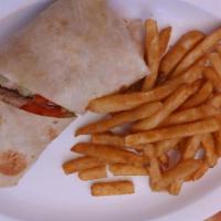 Chicken Salad Wrap · Served with lettuce and cheddar cheese. Made on white flour or honey wheat tortilla. Include...